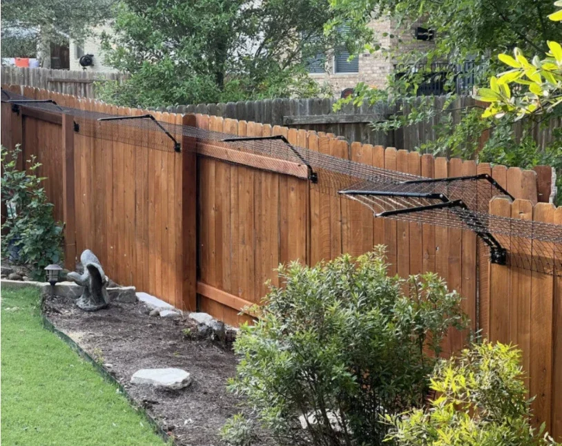 Custom pet fence installation designed to keep your pets safe while enhancing your outdoor space.